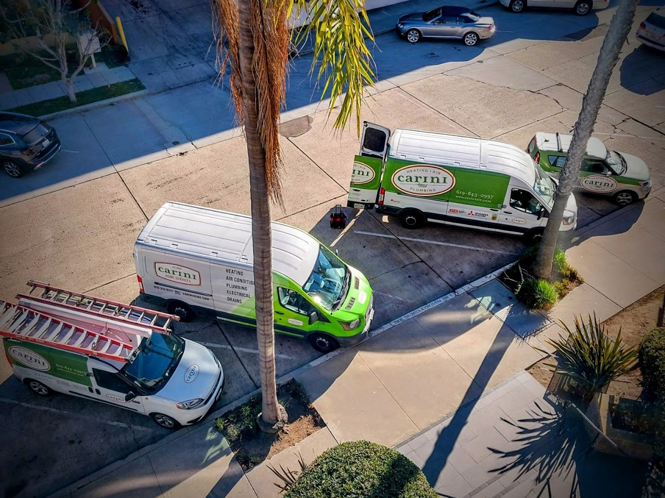 Home Service vans parked on a street in san diego