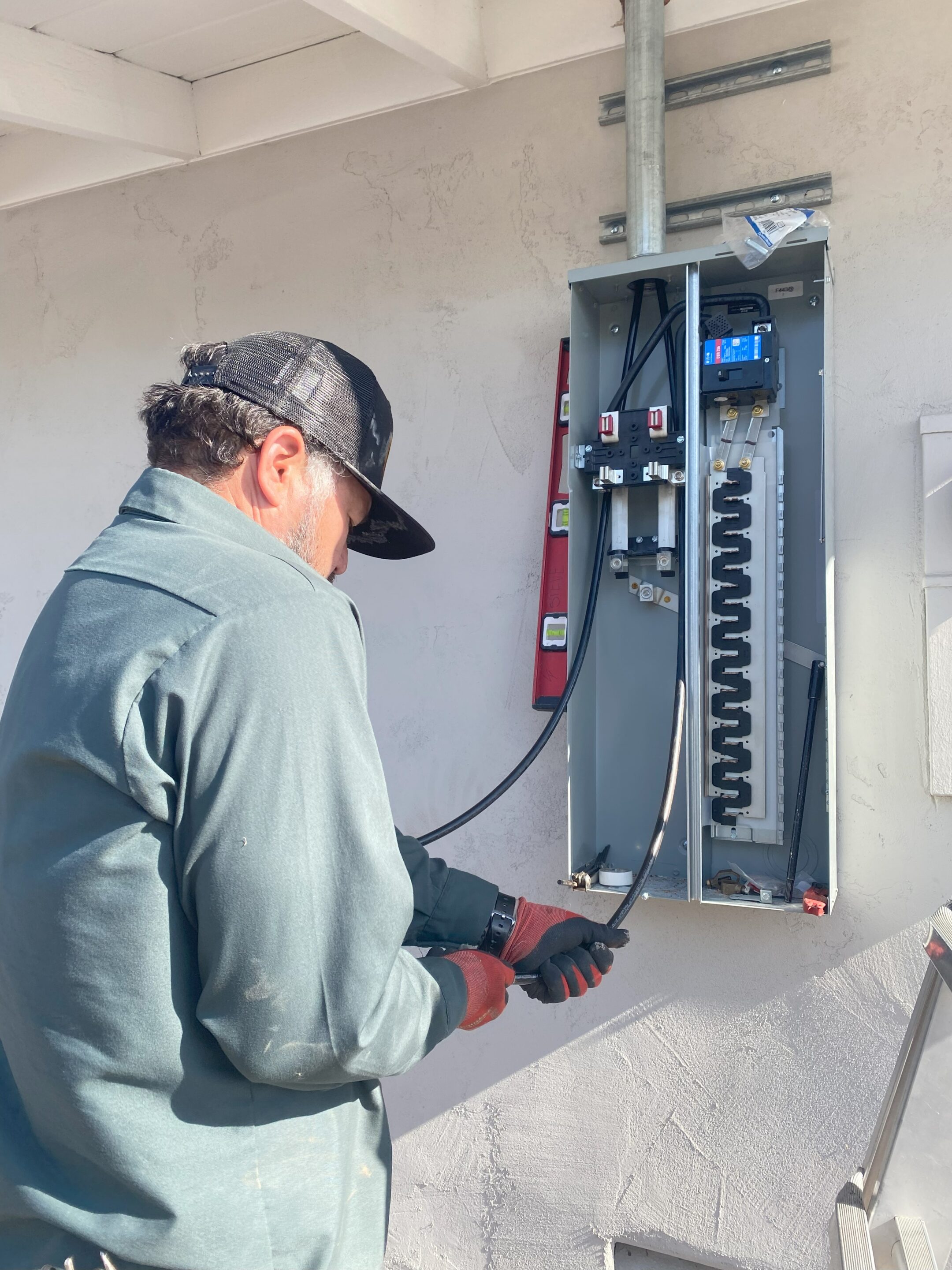 electrician working on an electrical panel in san diego